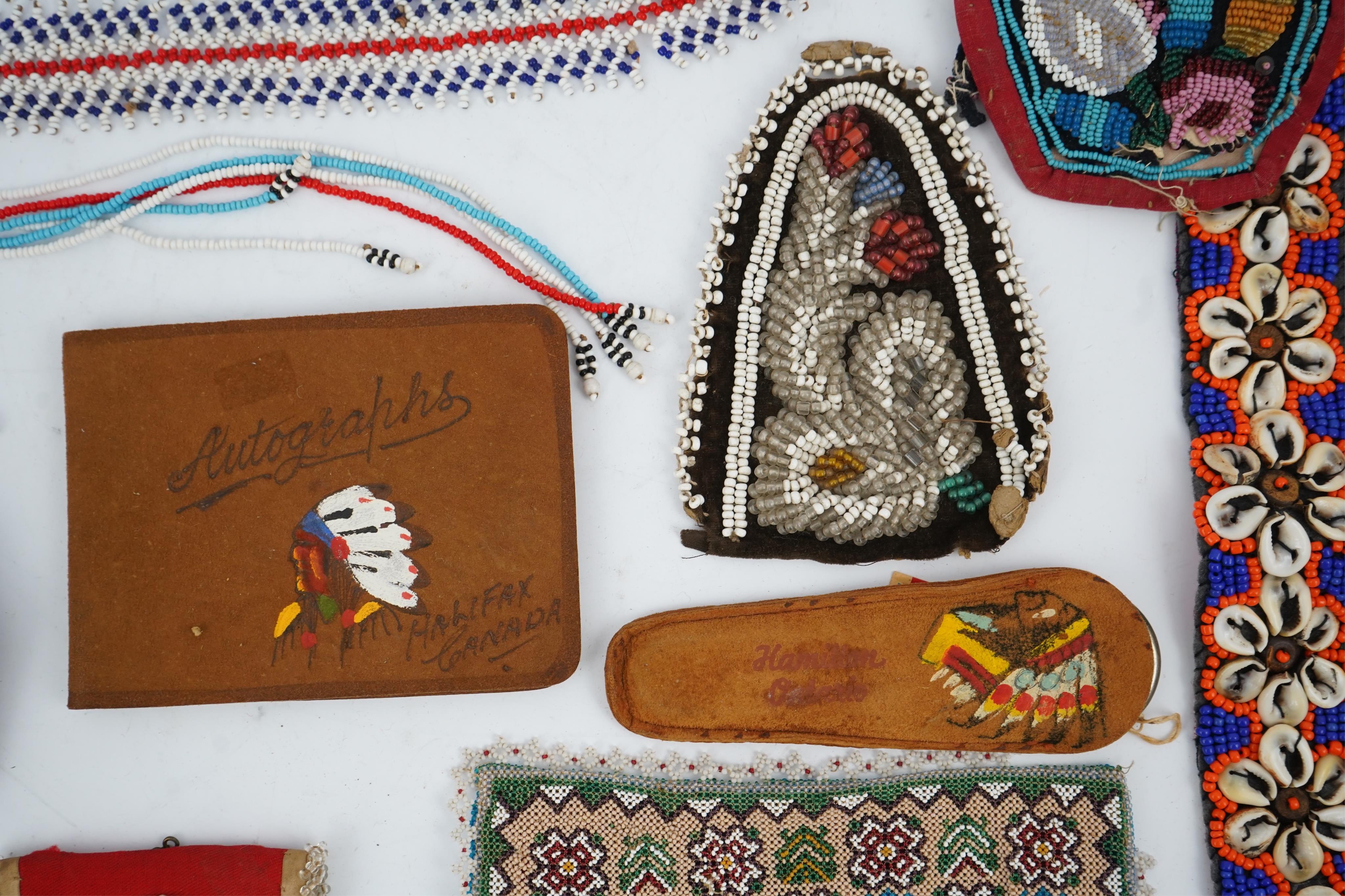 A collection of mixed decorative bead work, including five items of Native American beadwork, together with an early beadwork bag and later beaded items. Condition - moccasins, bead panel, circular bed purse with metal l